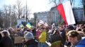 Anti-war protest outside Russian embassy in Warsaw. Demonstrators call for peace and condemn Putin.