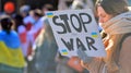 Anti-war protest outside Russian embassy in Warsaw. Demonstrators call for peace and condemn Putin.