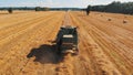 Warsaw, Poland 10.08.2020 Harvesting season. Combine working on the wheat field. Aerial wide