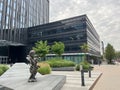 WARSAW, POLAND - JULY 13, 2022: Beautiful view of city street with big building, sculpture and green trees Royalty Free Stock Photo