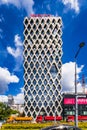 The facade of the Prosta Tower office building with an unusual, modern shape