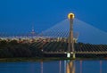 Warsaw, Poland - July 20, 2016: Panoramic view of the rising fullmoon over the National Stadium and Swietokrzyski Bridge