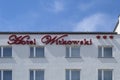 Signboard Hotel Witkowski on a background of blue sky