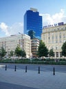 Contemporary modern architecture between buildings in socialist realist style in downtown Warsaw.