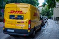Warsaw, Poland - June 28, 2019: DHL delivery yellow bus. Transportation of parcels and mail. Transport in the city on