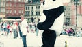 WARSAW, POLAND - JUNE 10, 2017. Man wearing big panda costume walk on the old town street