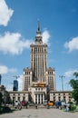 WARSAW, POLAND - JUNE 15, 2016: People walking in front of Palace of Culture and Science, skyscraper, symbol of communism and