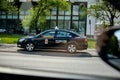 WARSAW. POLAND - June 2016: Taxi on the streets of Warsaw, Poland. Traffic on the roads, taxi cars carry passengers.