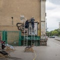 Warsaw. Poland 8 June 2020 two men perform and paint facade work n the street in the center of the city