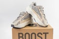 Adidas Yeezy boost 700 V2 Cream. limited collection sneakers with box. white background. Royalty Free Stock Photo