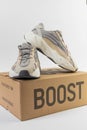 Adidas Yeezy boost 700 V2 Cream. limited collection sneakers with box. white background. Royalty Free Stock Photo