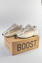 Adidas Yeezy boost 700 V2 Cream. limited collection sneakers with box. white background. Royalty Free Stock Photo