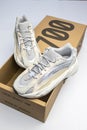 Adidas Yeezy boost 700 V2 Cream. limited collection sneakers with box. white background. Royalty Free Stock Photo