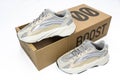 Adidas Yeezy boost 700 V2 Cream. limited collection sneakers with box. white background.