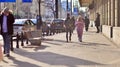 Warsaw, Poland. 8 March 2023. Crowd of people walking down an urban sidewalk Royalty Free Stock Photo