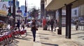 Warsaw, Poland. 8 March 2023. Crowd of people walking down an urban sidewalk Royalty Free Stock Photo