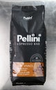 Warsaw, Poland - March 9, 2020:Italian espresso coffee Pellini Top, espresso bar on a gray steel background.Whole bean coffee.
