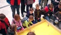 WARSAW, POLAND - MARCH, 4, 2017. Kids enthusiastically operating small gyro robots using tablet computer