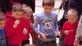 WARSAW, POLAND - MARCH, 4, 2017. Little boys enthusiastically operating small robots using tablet computer