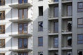 Unfinished residential building with broken windows - abandoned real estate project