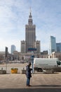 WARSAW, POLAND - March 2018 View of palace with tourist reading a map - Warsaw City Center