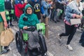 05.28.2022 Warsaw, Poland. Middle-aged caucasian woman with walking disability sitting on a wheelchair fighting for the