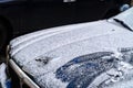 Warsaw, Poland - November 29, 2016: Jaguar emblem and logo on the hood of the car. The car is covered with snow