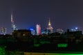 Beautiful night cityscape of high skyscrapers of Warsaw city highlighted by colorful lights