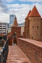 Beautiful red brick old town fortifications with defensive walls and towers and warsaw Barbican Royalty Free Stock Photo