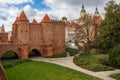 Beautiful red brick old town fortifications with defensive walls and towers and warsaw Barbican Royalty Free Stock Photo