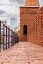 Beautiful red brick old town fortifications with defensive walls and towers and warsaw Barbican Royalty Free Stock Photo