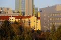 The setting sun illuminates the buildings