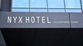 Sign NYX Hotek. Company signboard NYX Hotel.