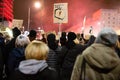 Protesters marching in Warsaw with banners