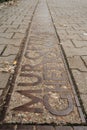 Warsaw, Poland - September 20,2021. Sign on ground where the wall of the Jewish Warsaw ghetto was located during the World War