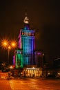 Warsaw,Poland-September 19,2021.View of illuminated colorful Palace of Culture and Science at night.Art deco high rise building