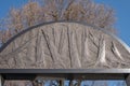 Close up of Umschlagplatz Memorial with tree behind, collection point for Jews from the Warsaw Ghetto.