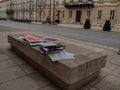 Warsaw/Poland - 21/03/2020 - Books for take away on the bench, empty street due to coronavirus pandemic