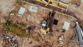 06.08.2022 - Warsaw, Poland - Top down view of the excavator working on the demolition site Royalty Free Stock Photo