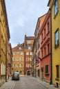 Warsaw, Poland - Typical old town street with XIX century tenements - Krzywe Kolo street - in Starowka historic quarter in Warsaw Royalty Free Stock Photo