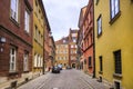 Warsaw, Poland - Typical old town street with XIX century tenements - Krzywe Kolo street - in Starowka historic quarter in Warsaw Royalty Free Stock Photo