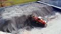 Using heavy machinery to transport material at gravel dump