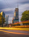 Warsaw, Poland - a view of a skyscraper in the business part of the city. Office buildings in the Warsaw. Long exposure tram Royalty Free Stock Photo