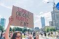 Warsaw, Poland 25.06.2022- young woman in glasses holding poster for judging the war - equality parade