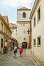 Warsaw\'s Old Town. Small street with walking tourists