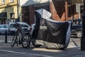 Warszawa, Poland, 25.04.2019: bike, motorcycle covered in the parking lot in the city