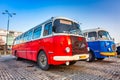 Warszawa, Poland - February 25, 2021: Vintage trip buses parked under the Palace of the Culture and Science in Warsaw city center