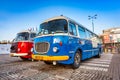 Warszawa, Poland - February 25, 2021: Vintage trip buses parked under the Palace of the Culture and Science in Warsaw city center