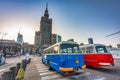 Warszawa, Poland - February 25, 2021: Vintage trip buses parked under the Palace of the Culture and Science in Warsaw city center