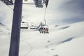 Warth,Austria,Skilifts in the mountains with sun, clouds and fresh snow Royalty Free Stock Photo